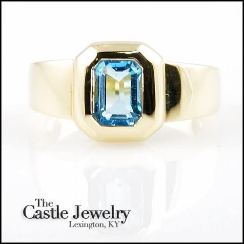 EMERALD CUT BLUE TOPAZ BEZEL SET 14 KARAT Y/G  