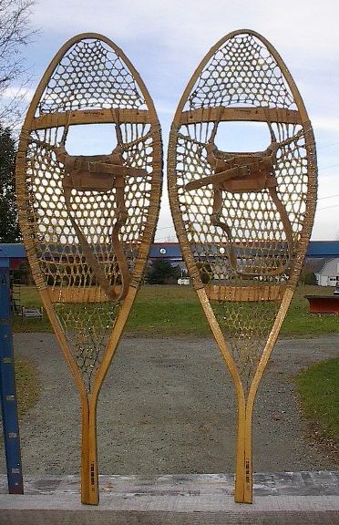   snowshoes have leather bindings. The snowshoes measures 42 long by 14